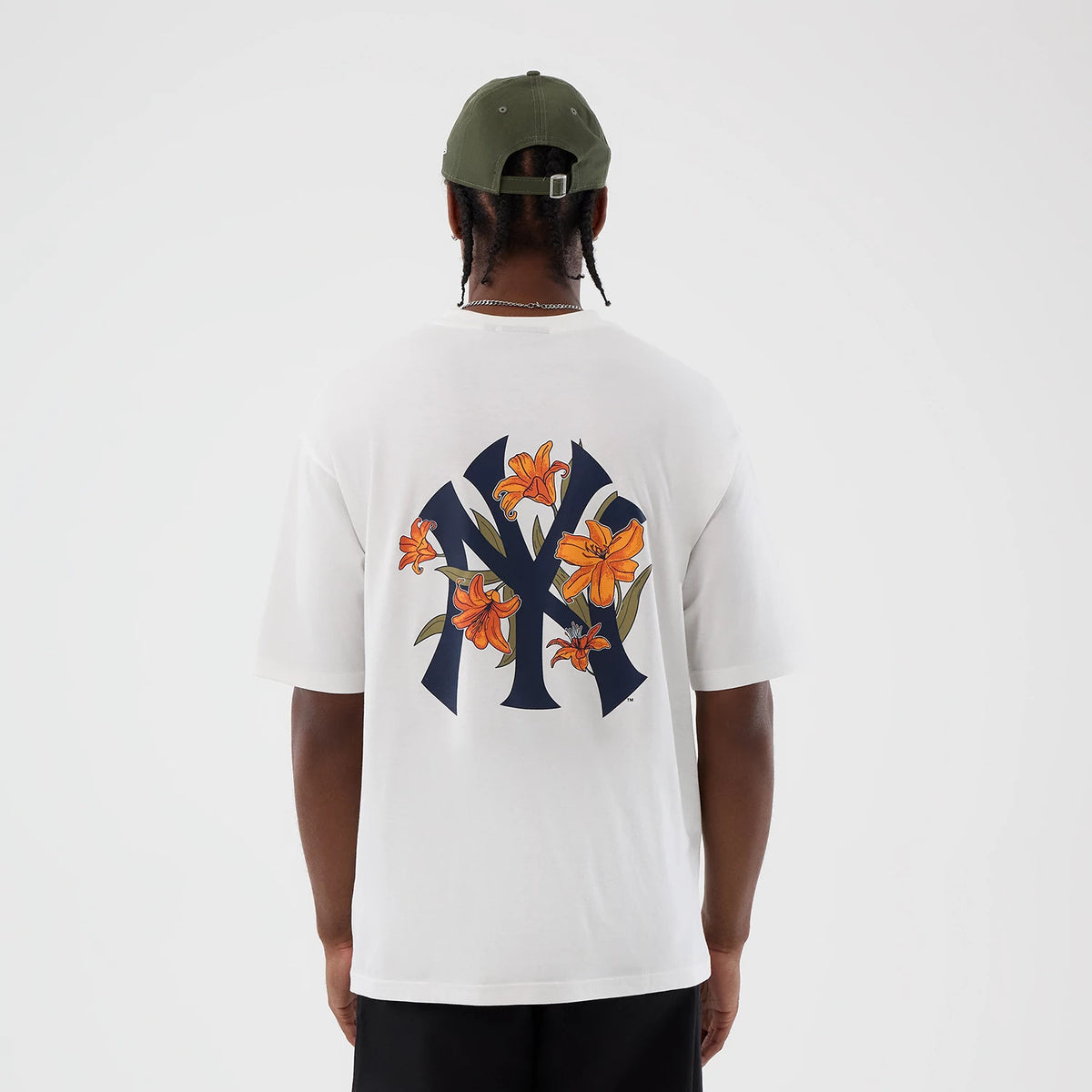 The model is wearing this MLB Floral New York Yankees Oversized T-Shirt in white. 2