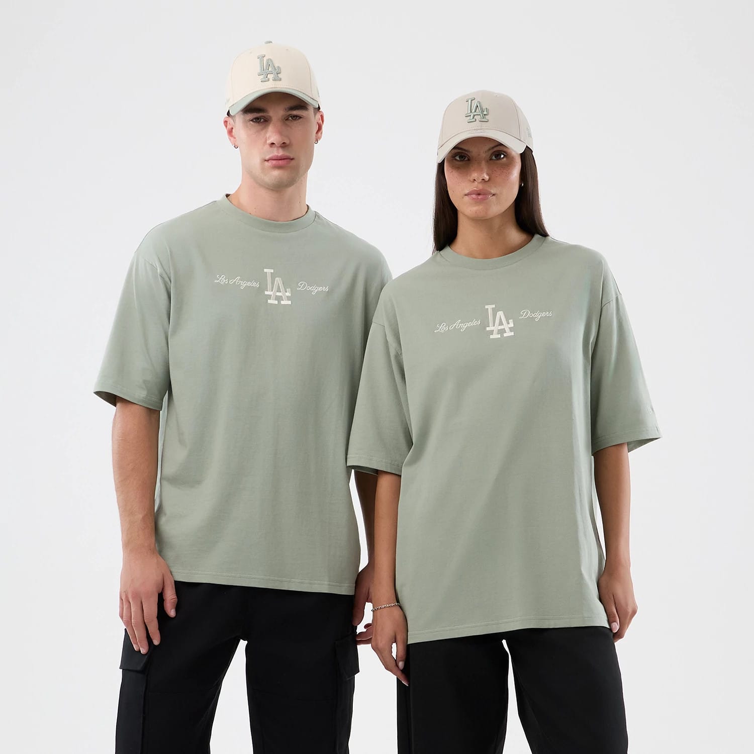 The model is wearing this MLB Script LA Dodgers Oversized T-Shirt in pastel green. 1