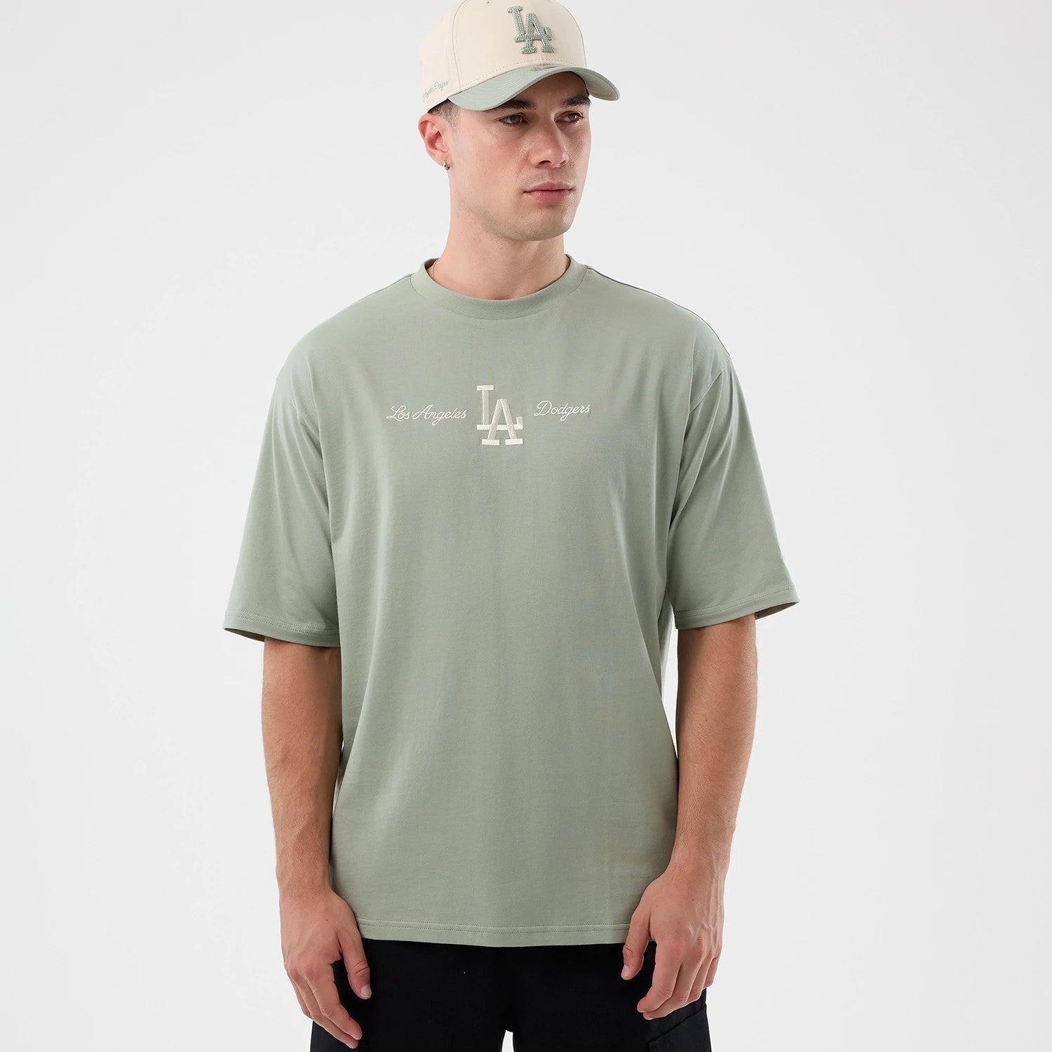 The model is wearing this MLB Script LA Dodgers Oversized T-Shirt in pastel green. 3