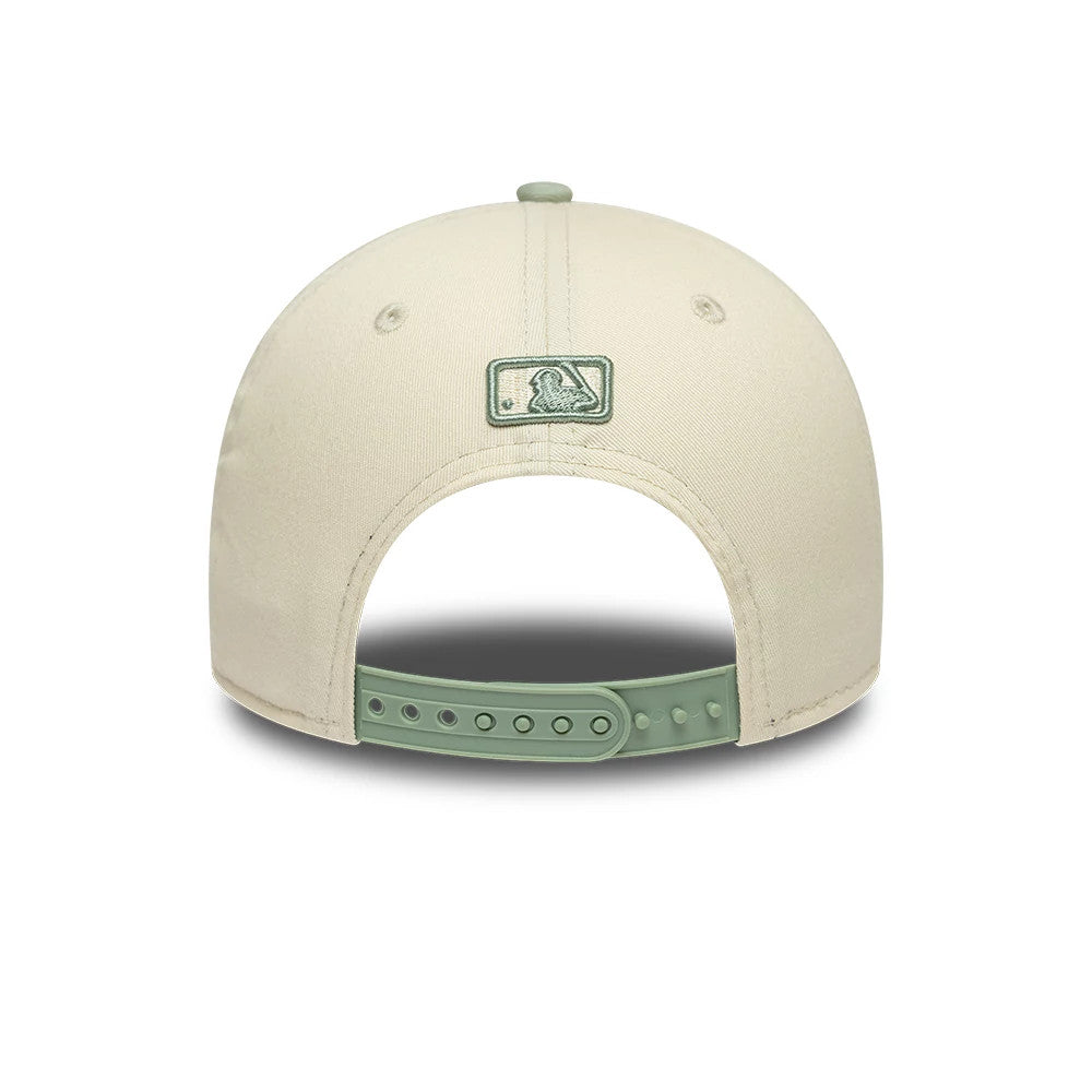 LA Dodgers MLB Side Script Cream New Era 9FORTY M-Crown Adjustable Cap, rear view showing the green embroidered MLB Batterman logo at the centre of the cream back panels, with a matching green adjustable strap and top button.