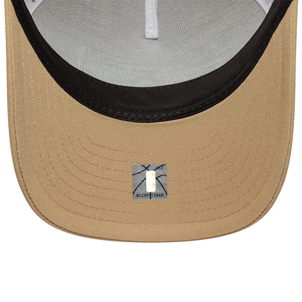 LA Lakers NBA Beige New Era 9FORTY M-Crown A-Frame Trucker Adjustable Cap, inside view showing the grey fabric undersides of the white-taped crown, black undervisor, and size label positioned at the centre of the beige visor.