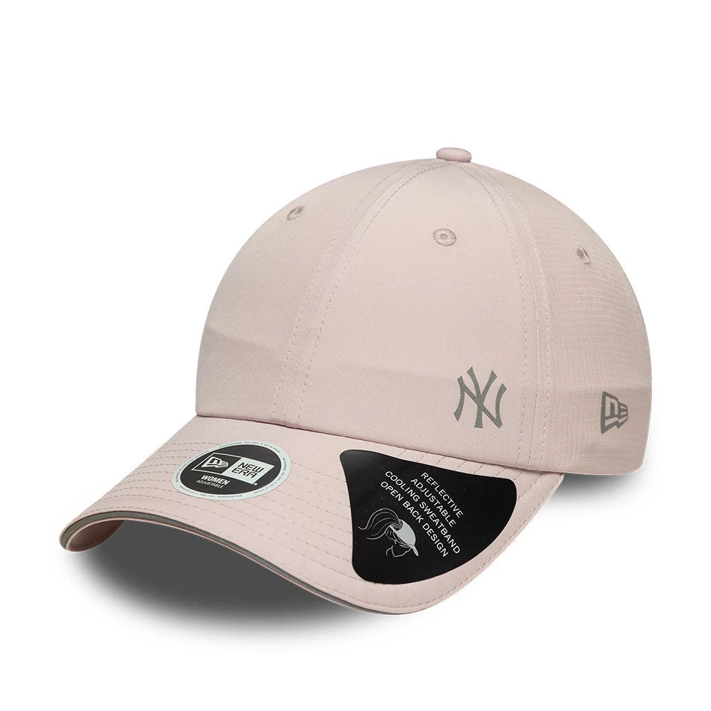 New Era New York Yankees Womens MLB Mesh Pastel Pink Pony Tail Cap, three-quarter view showing a raised grey embroidered NY logo on the front panel, curved pink visor with a 9FORTY size sticker, and New Era flag logo on the left side.