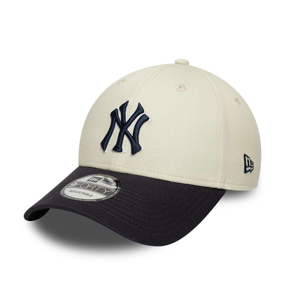 New York Yankees MLB World Series Patch Cream New Era 9FORTY Adjustable Cap, front view showing a raised navy NY logo on the cream front panel, contrasted with a curved black visor beneath the 9FORTY size sticker.