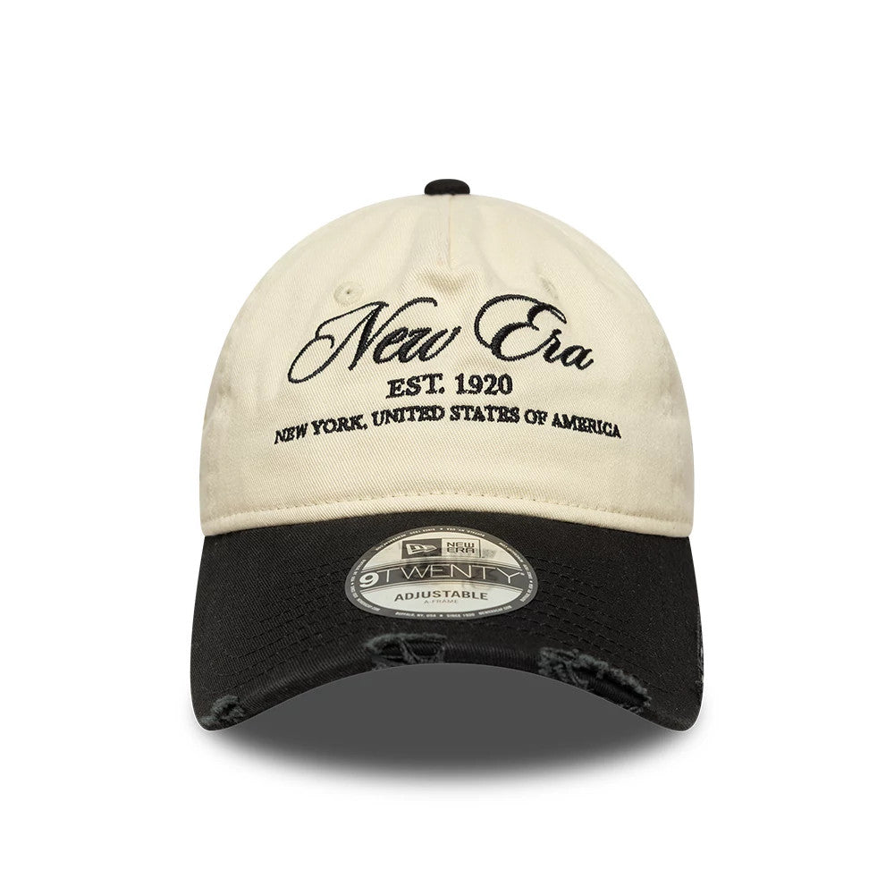 Pictured is this New Era Wash Distress 9TWENTY A-Frame cap in light beige. 2