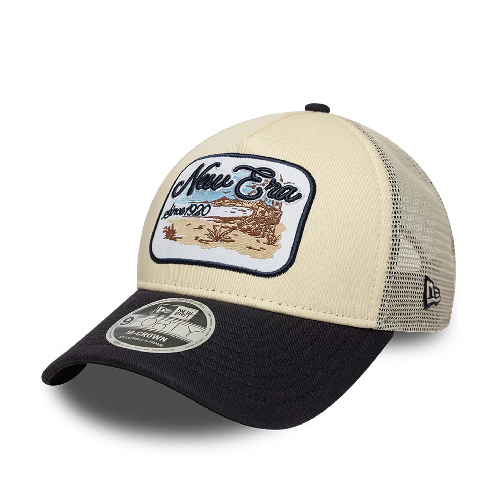 Pictured is this New Era 9FORTY M-Crown A-Frame Trucker cap in light beige. 1