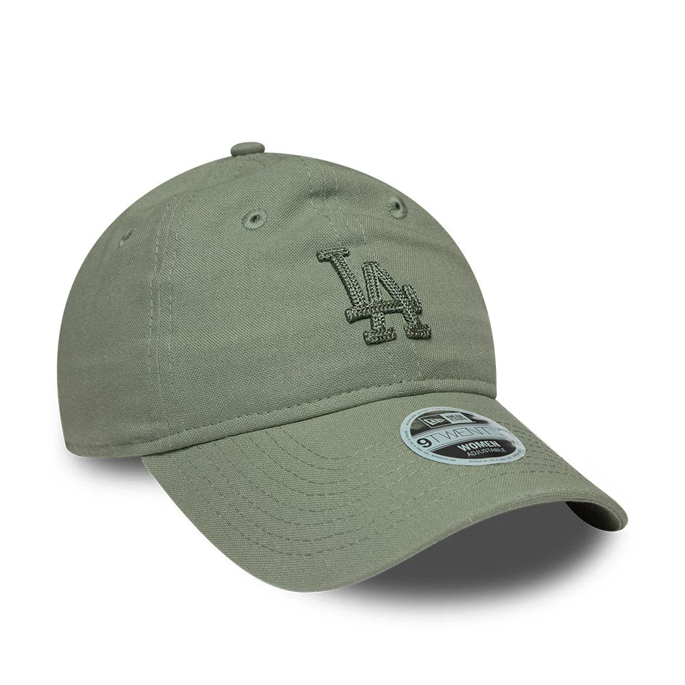 LA Dodgers Womens MLB Linen Pastel Green New Era 9TWENTY Adjustable Cap, three-quarter view showing the raised embroidered LA logo on the front panel in matching pastel green, curved visor with 9TWENTY size sticker, and fabric top button.
