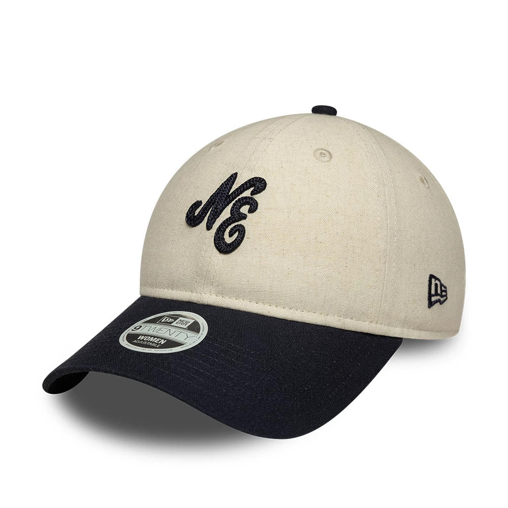 Womens New Era Linen Navy 9TWENTY Adjustable Cap, front view showing an embroidered NE script logo on the cream crown, a navy curved visor with the 9TWENTY size sticker, and a New Era flag logo on the left side.