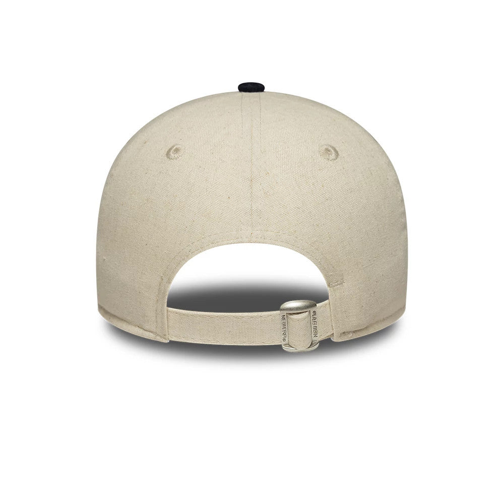 Womens New Era Linen Navy 9TWENTY Adjustable Cap, rear view showing a curved opening and a fabric strap with a buckle for size adjustment, set on a lightly textured linen crown with a navy top button.