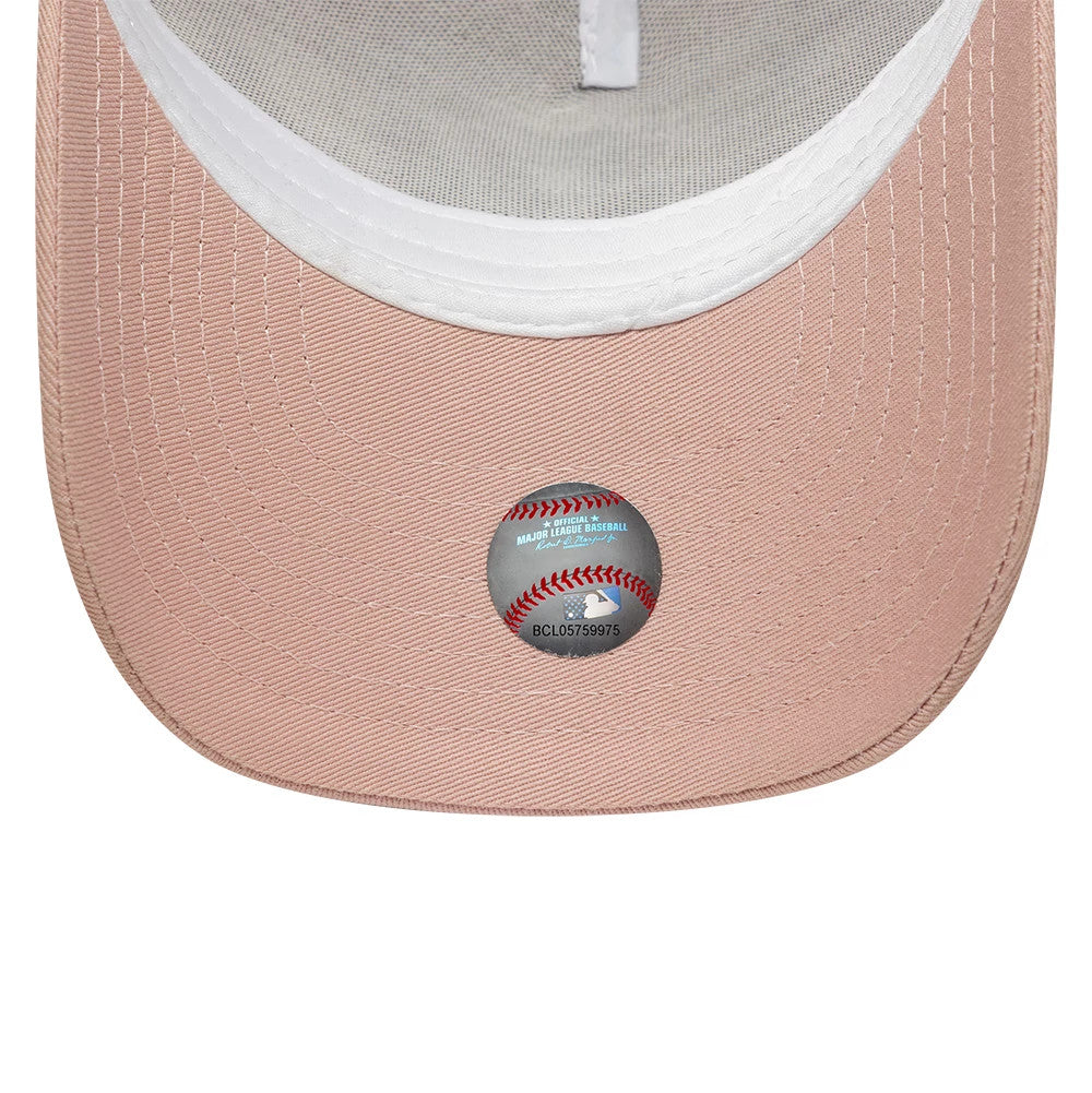 New York Yankees Youth MLB League Essential Pastel Pink New Era 9FORTY A-Frame Trucker Adjustable Cap, inside view showing a white sweatband and grey undervisor, with an MLB sticker placed centrally on the pastel pink visor.