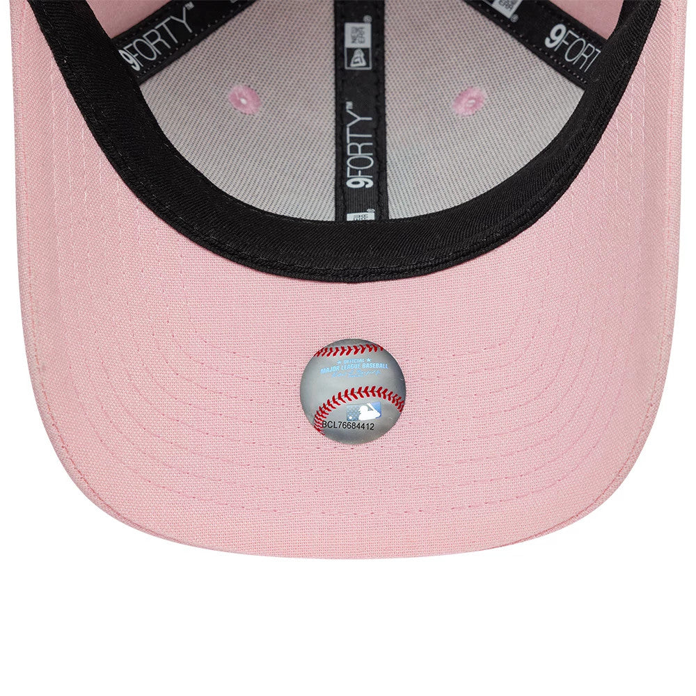 LA Dodgers Youth MLB Linen Pastel Pink New Era 9FORTY M-Crown Adjustable Cap, inside view with black taping featuring 9FORTY branding, a black sweatband, and a pink undervisor adorned with a white sticker displaying a baseball design.