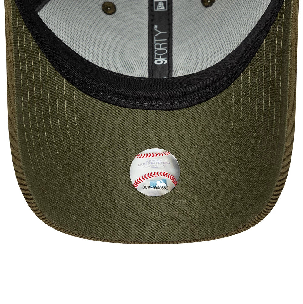 New York Yankees MLB Soft Cord Dark Green New Era 9FORTY Adjustable Cap, inside view showing the black sweatband with an embroidered 9FORTY label, dark green undervisor, and a round baseball-themed sticker in the centre.