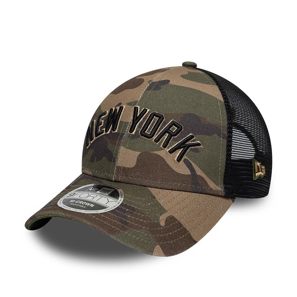 New York Yankees MLB Wordmark Woodland Camo New Era 9FORTY M-Crown Adjustable Cap, three-quarter view showing the raised black New York embroidery on the woodland camo front panel, the camouflage curved visor with a 9FORTY size sticker.