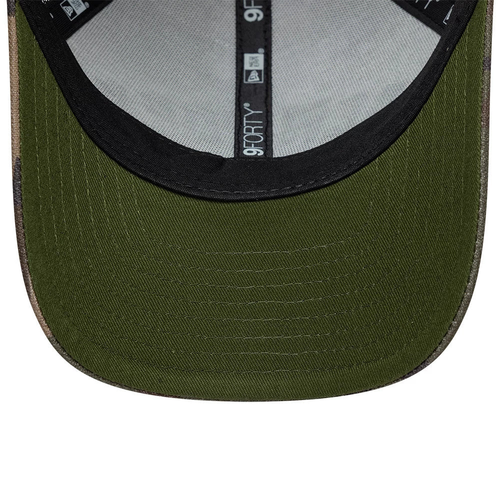 New York Yankees MLB Wordmark Woodland Camo New Era 9FORTY M-Crown Adjustable Cap, inside view showing the green undervisor, black sweatband, and New Era branded taping stretching across the interior panels of the structured crown.