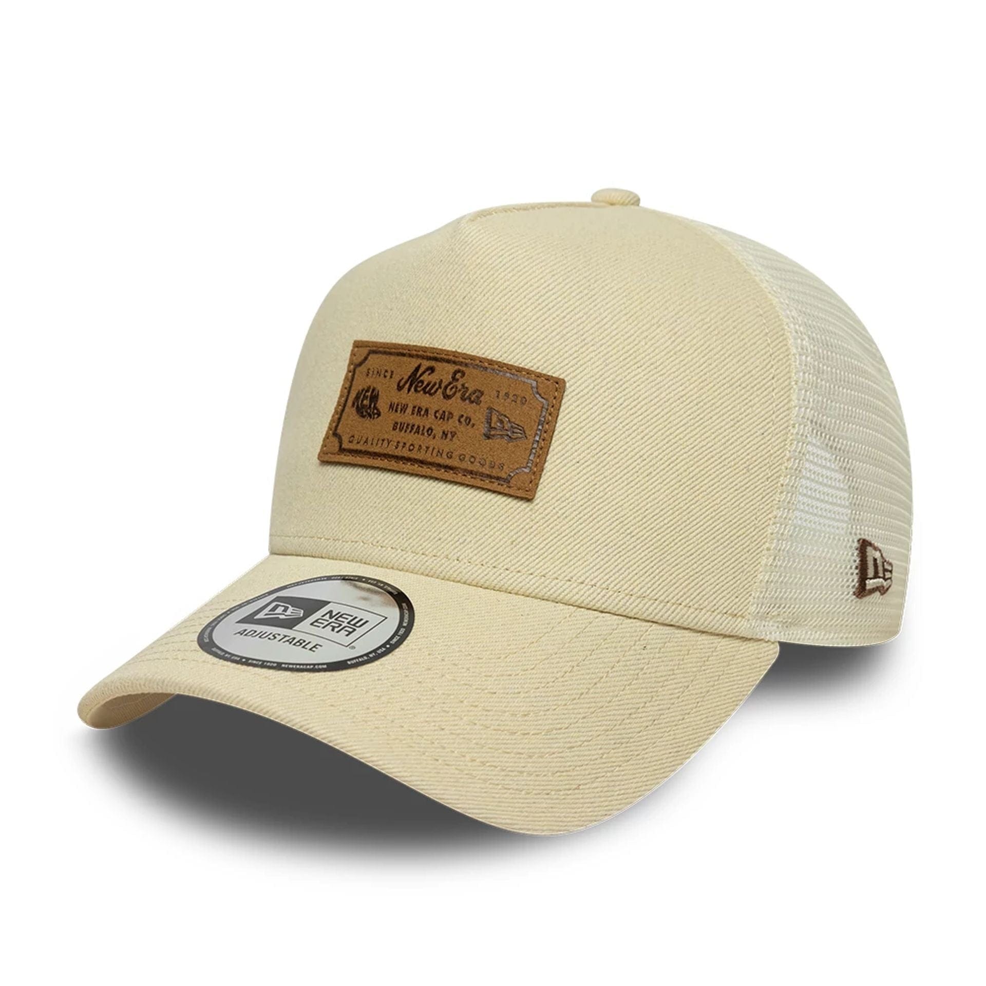 Pictured is this New Era Leather Patch 9FORTY A-Frame Trucker cap in light beige. 1
