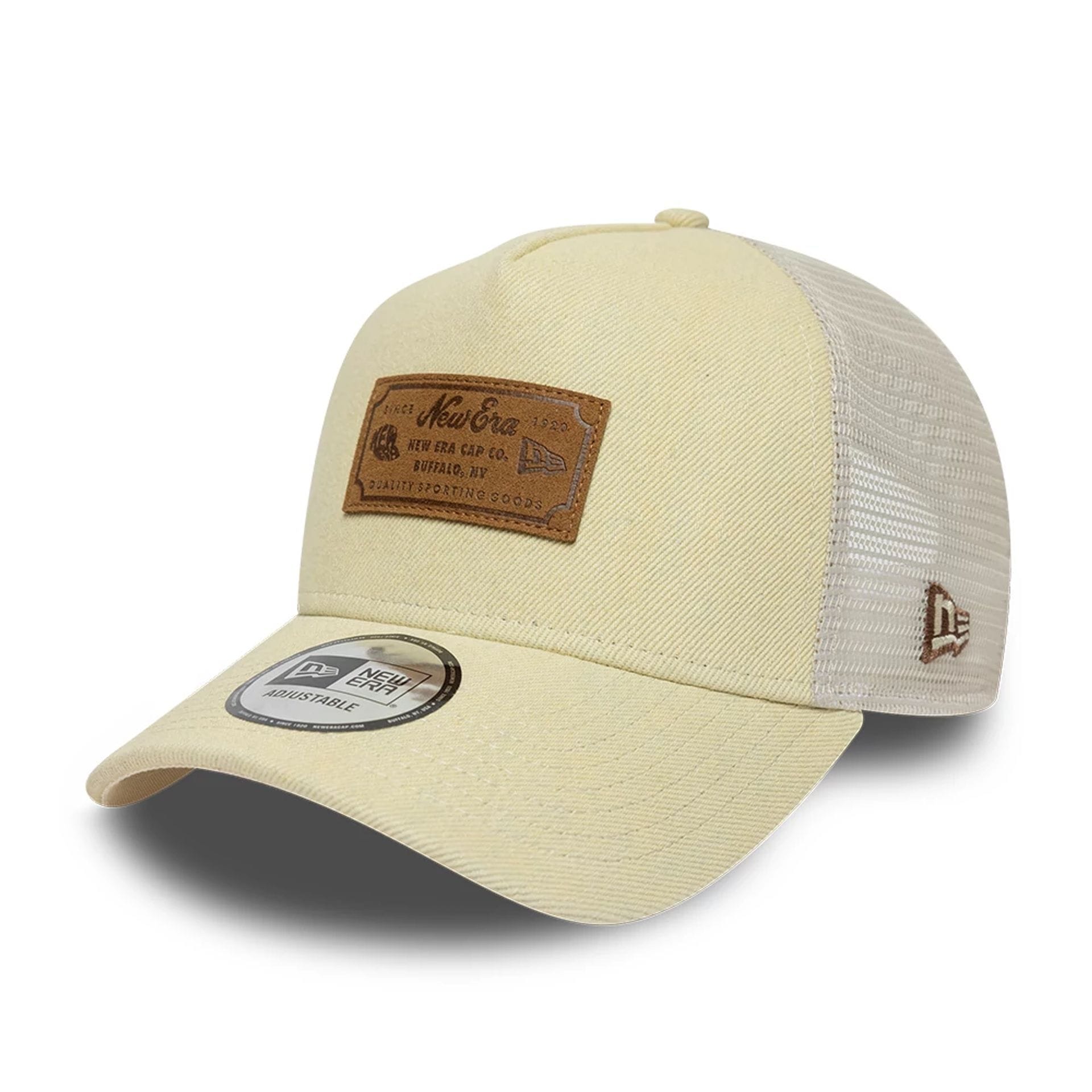 Pictured is this New Era Leather Patch 9FORTY A-Frame Trucker cap in light beige. 1