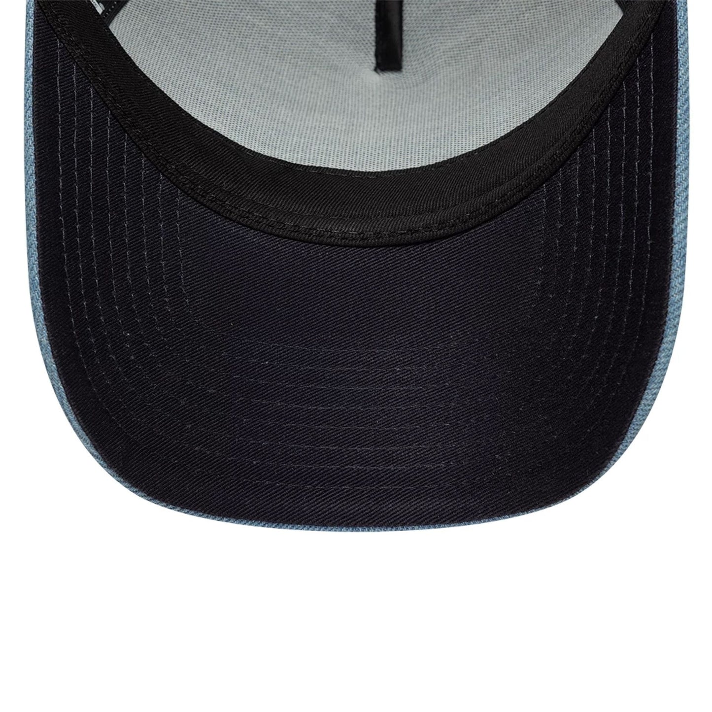 Pictured is this New Era Leather Patch Denim 9FORTY A-Frame Trucker cap in navy. 5