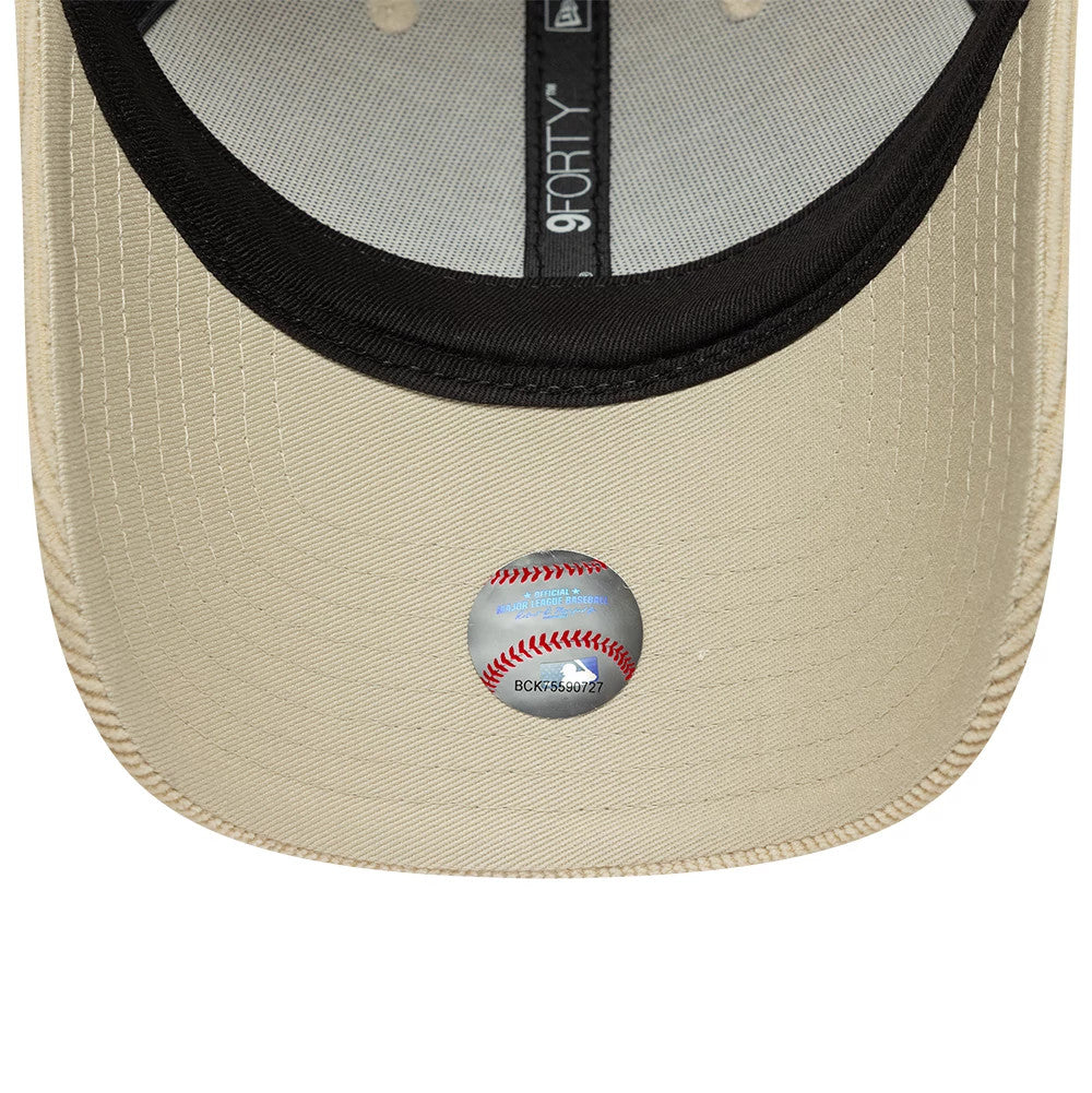 New York Mets MLB Soft Cord Cream New Era 9FORTY Adjustable Cap, inside view showing a black sweatband, contrasting grey taping with the 9FORTY logo, and a distinctive baseball-themed inner sticker on the cream undervisor.