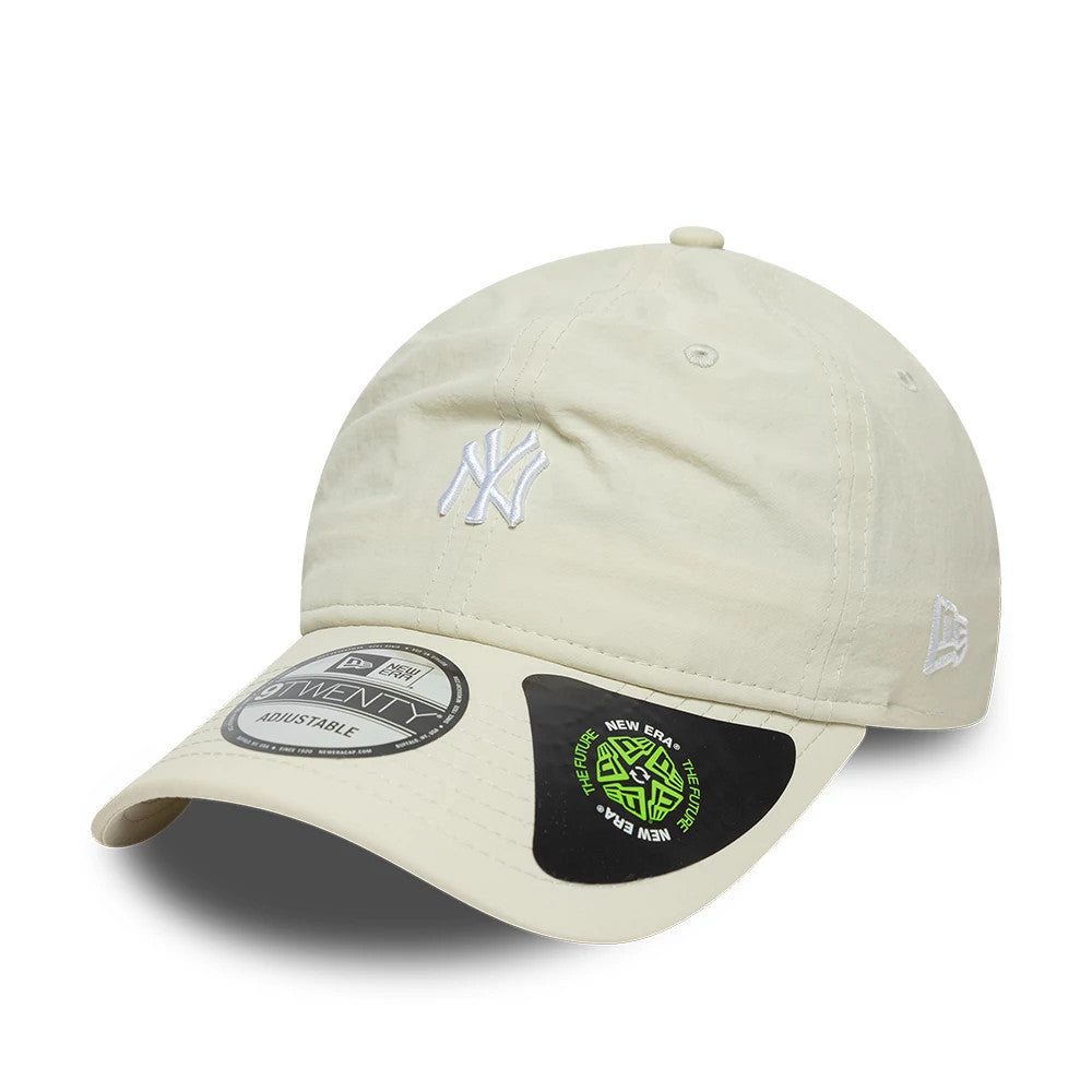New York Yankees MLB Recycled Light Beige New Era 9TWENTY Adjustable Cap, front view showing a white embroidered NY logo on the unstructured beige crown, curved visor with a 9TWENTY size sticker, and the New Era flag logo on the left side.