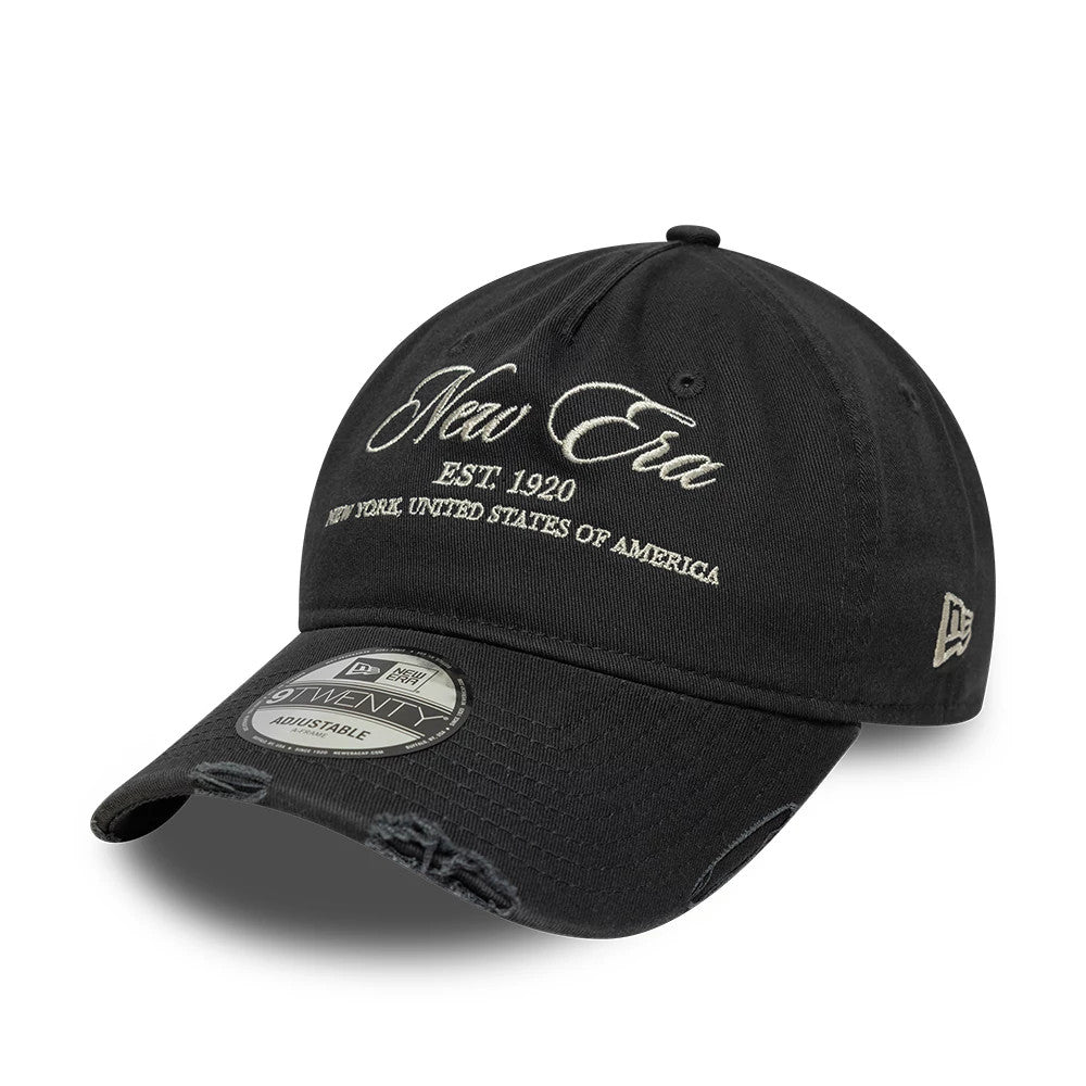 New Era Wash Distress Charcoal 9TWENTY A-Frame Adjustable Cap, front view showing the cream embroidered New Era script on the crown, charcoal distressed curved visor with a 9TWENTY size sticker, and embroidered New Era flag logo on the left side.