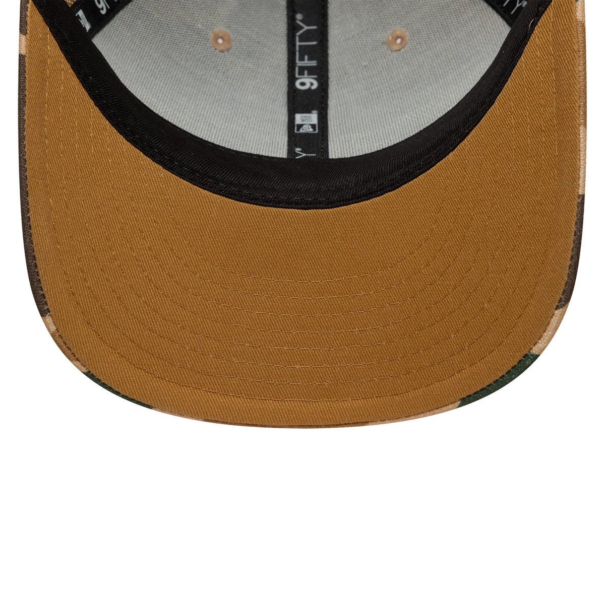 New Era Duck Camo Beige 9FIFTY Snapback Adjustable Cap, inside view showing the grey undervisor with black taping and the New Era logo, a dark sweatband, and contrasting beige stitching on the curved visor.