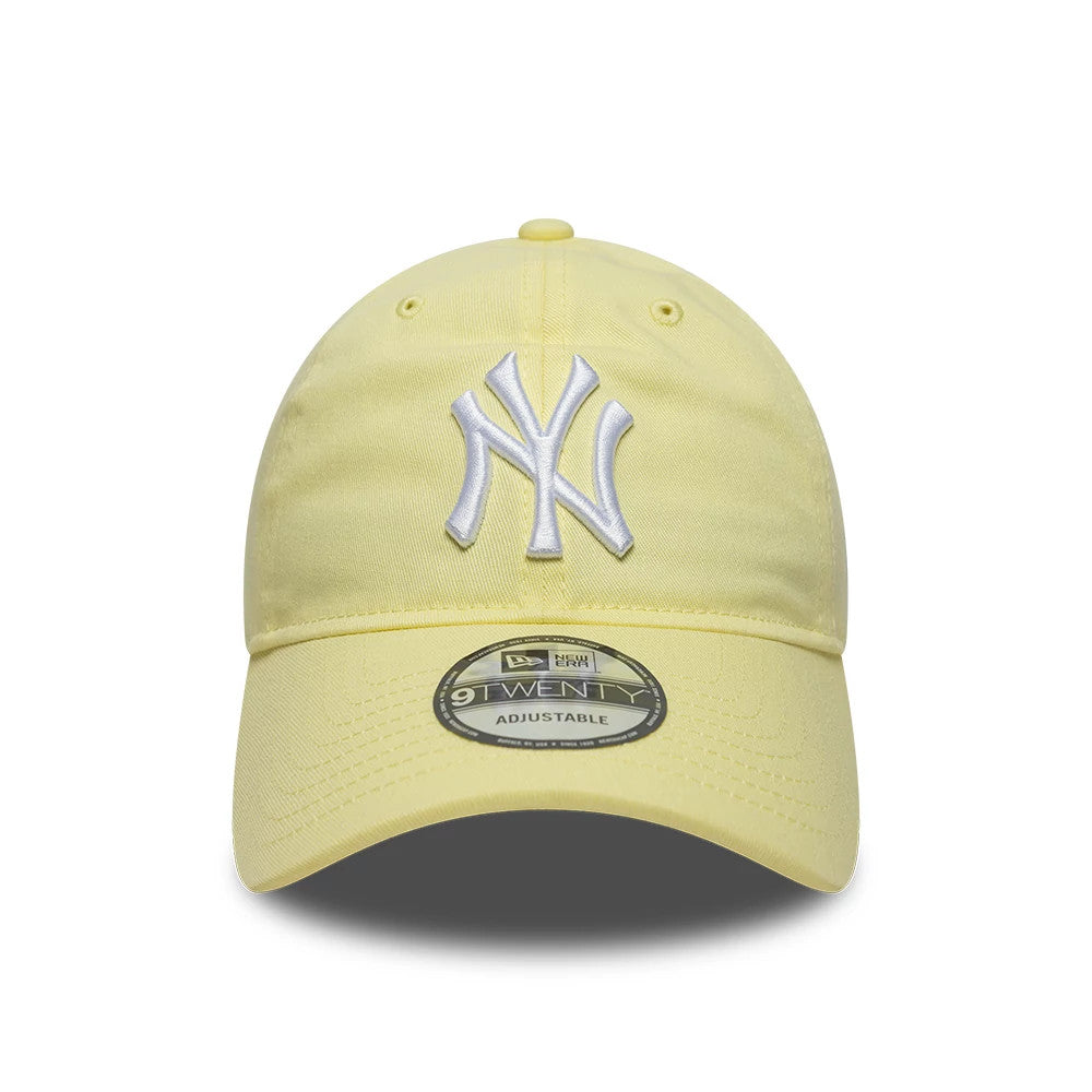 New York Yankees MLB League Essential Pastel Yellow New Era 9TWENTY Adjustable Cap, front view showing raised white NY logo embroidery centred on the unstructured pastel yellow crown, with a 9TWENTY size sticker on the curved pastel yellow visor.
