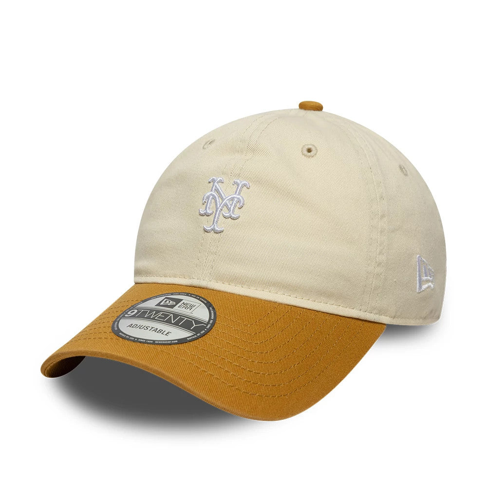 New York Mets MLB Washed Contrast Cream New Era 9TWENTY Adjustable Cap, three-quarter view showing the white embroidered Mets logo on the front panel, light cream crown with eyelets, contrast mustard-coloured visor and a 9TWENTY size sticker.