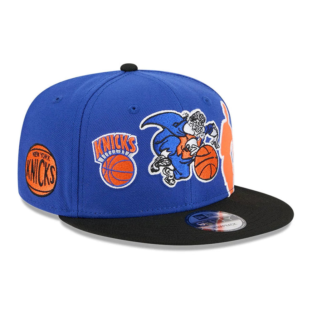 New York Knicks NBA Hardwood Classic ASG Blue New Era 9FIFTY Snapback Adjustable Cap, three-quarter view showing embroidered retro Knicks logos on the front panel, black flat visor with an NBA tag, and a 9FIFTY size sticker.