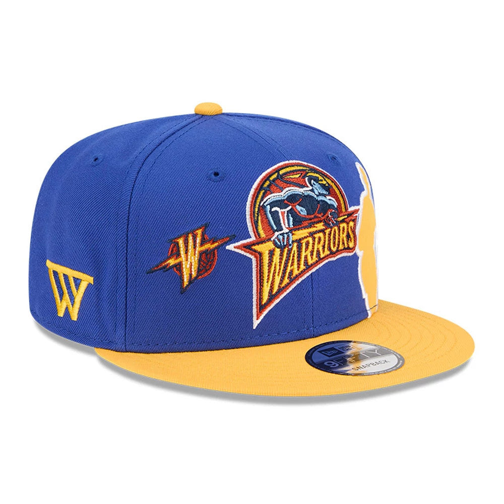 Warriors NBA Hardwood Classic ASG Blue New Era 9FIFTY Snapback Adjustable Cap, three-quarter view showing the embroidered Warriors logo on the front panel, contrasting yellow visor with a 9FIFTY size sticker, and a yellow side logo.
