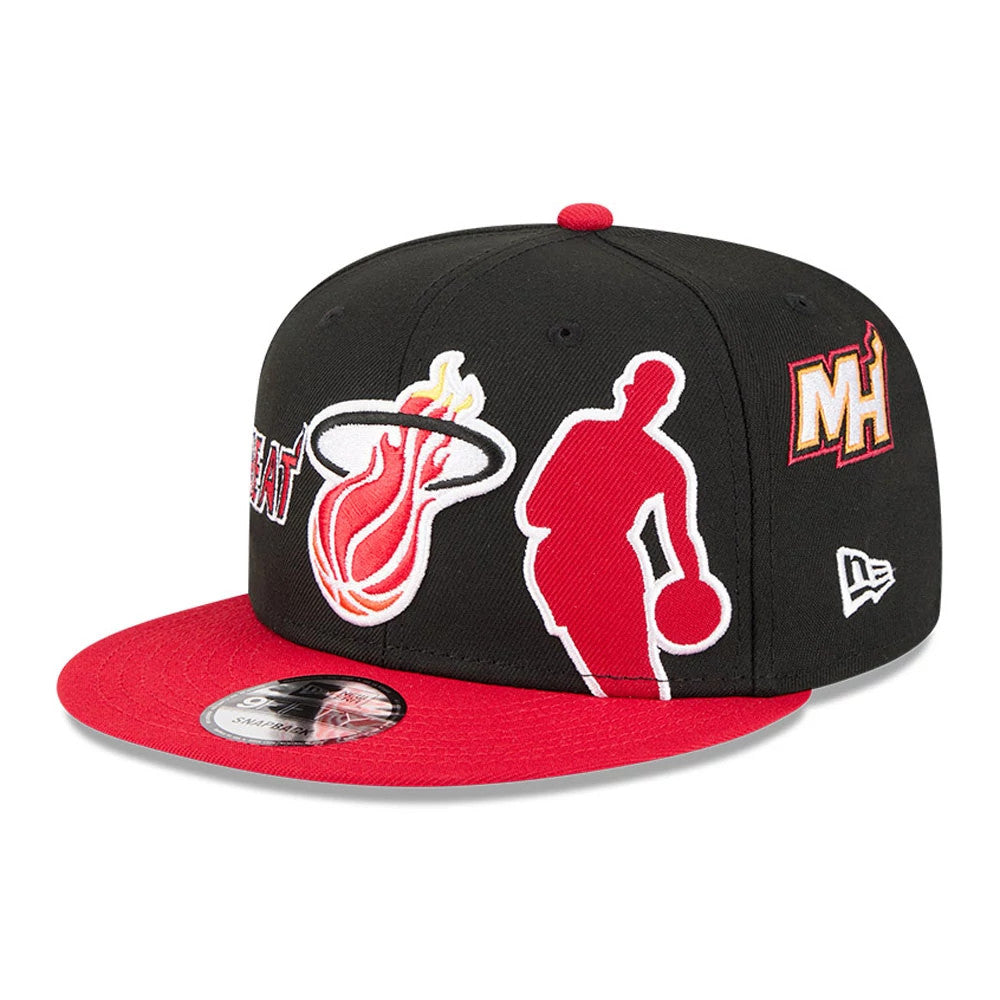 Miami Heat NBA Hardwood Classic ASG Black New Era 9FIFTY Snapback Adjustable Cap, front view showing the red and white embroidered Miami Heat logo, a red visor with a 9FIFTY size sticker, and the white New Era flag logo on the left side.