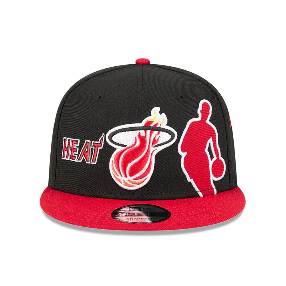 Miami Heat NBA Hardwood Classic ASG Black New Era 9FIFTY Snapback Adjustable Cap, front view showing the Heat wordmark, flaming basketball logo, and a red player silhouette in raised embroidery across the black front panels, with a red visor.