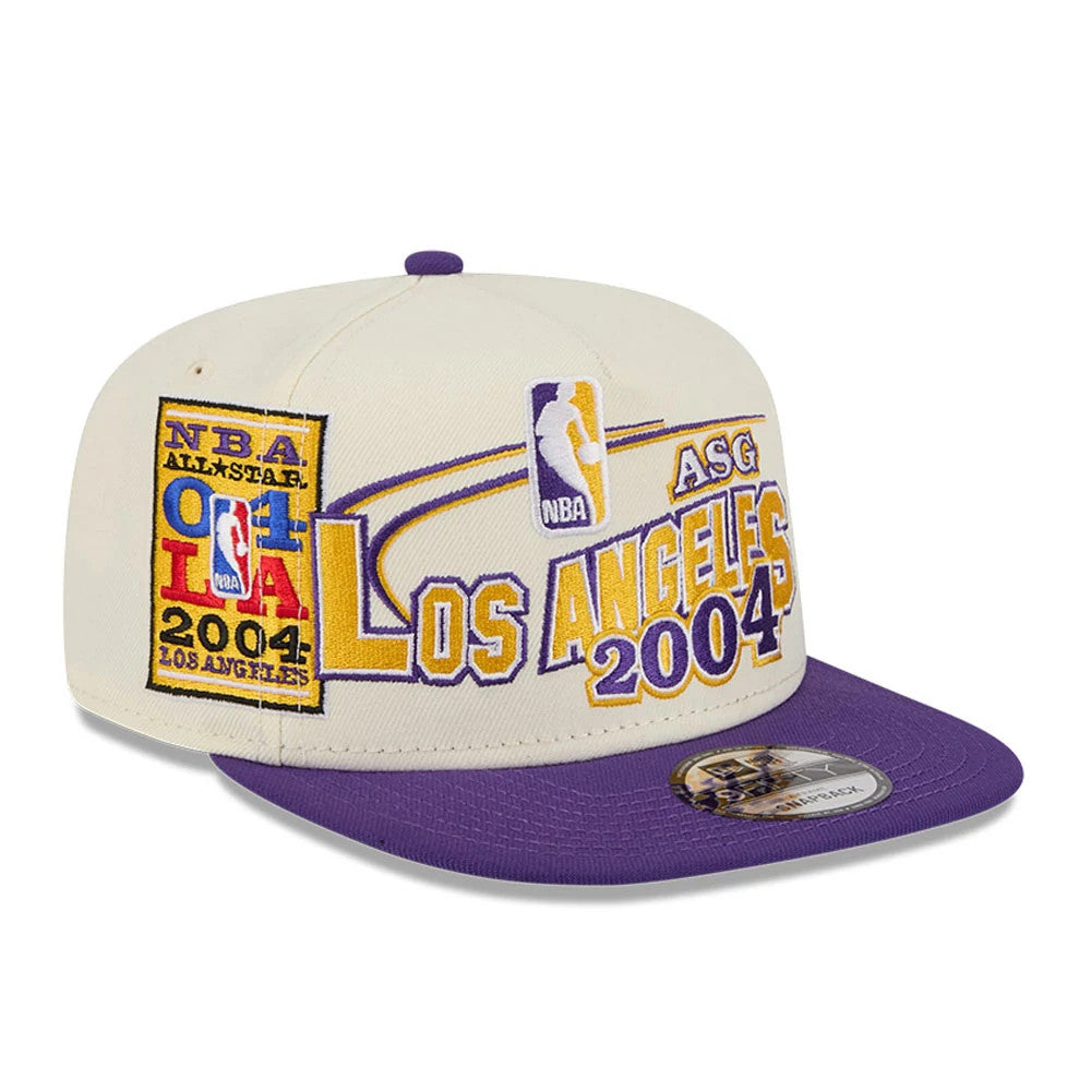 LA Lakers NBA Hardwood Classic ASG White New Era 9FIFTY A-Frame Snapback Cap, front view showing the embroidered NBA ASG Los Angeles 2004 logo in purple and gold on the cream front panels, with a purple flat visor and 9FIFTY size sticker.