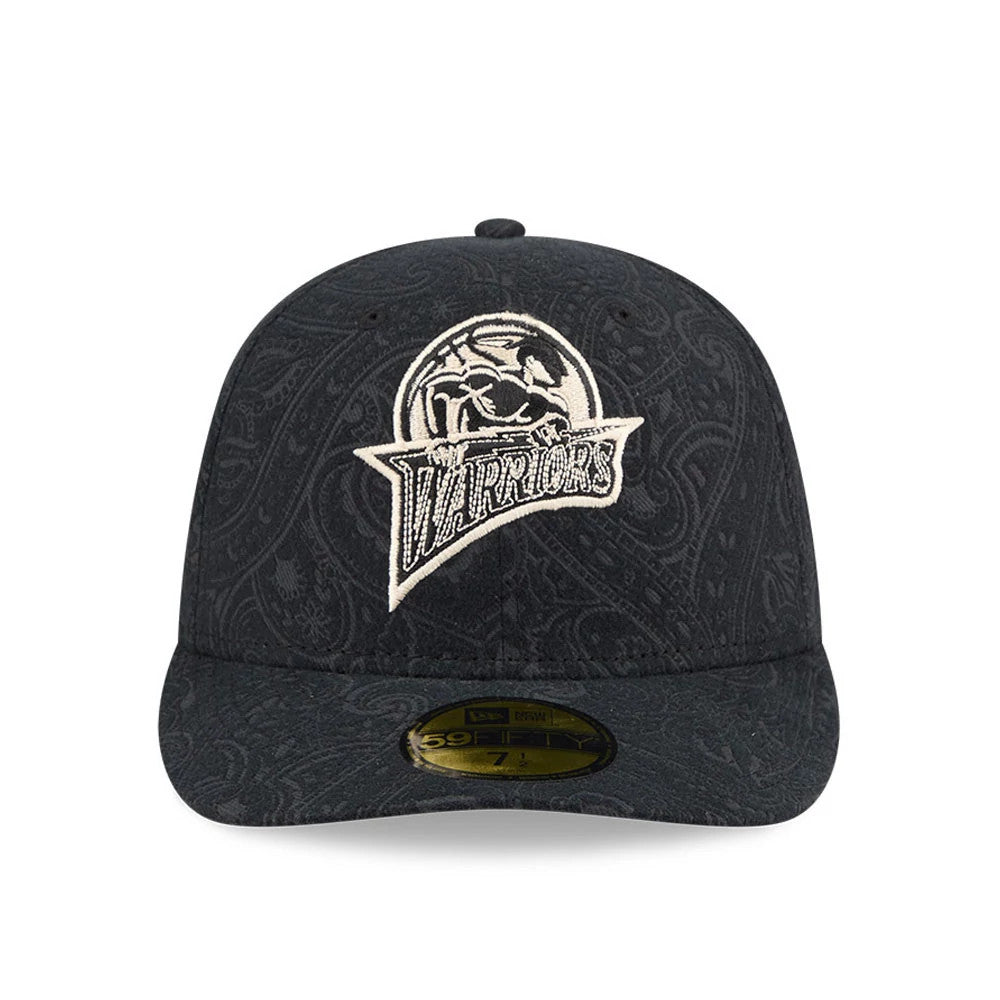 Golden State Warriors NBA Brushed Cotton Black New Era 59FIFTY Fitted Cap, front view showing the intricately detailed white embroidered Warriors graphic on the dark paisley-patterned crown, with a gold 59FIFTY size sticker on the black flat visor.