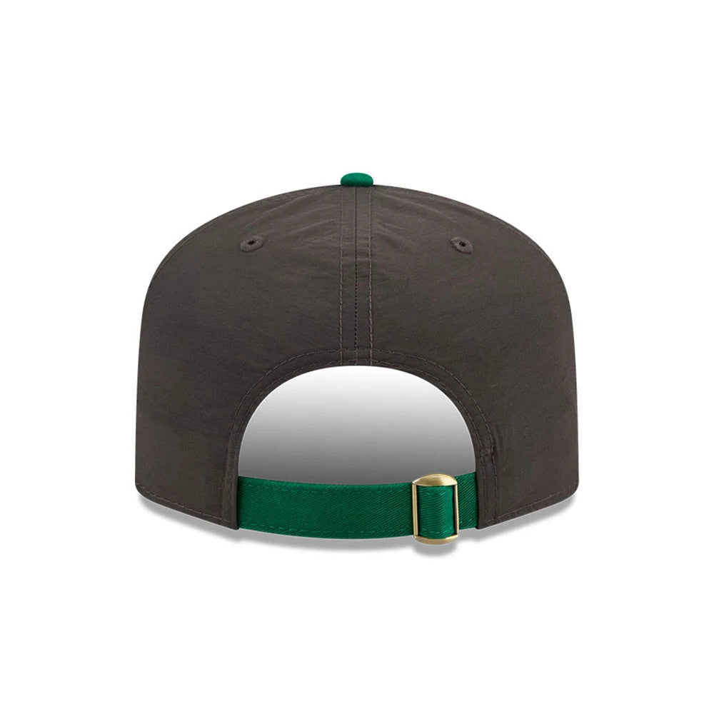 Boston Celtics NBA Nylon Black New Era 19TWENTY Adjustable Cap, rear view showing a green adjustable strap with a gold buckle, dark eyelets on the black nylon crown, and a green top button centred on the crown.