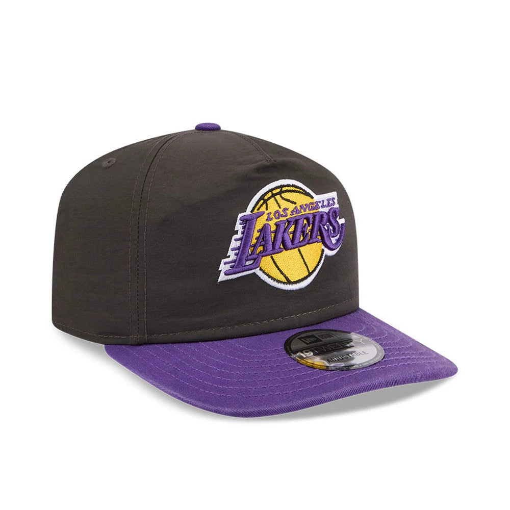 LA Lakers NBA Nylon Black New Era 19TWENTY Adjustable Cap, three-quarter view showing the purple raised embroidered Lakers logo on the front panel, paired with a contrasting purple curved visor and a 19TWENTY size sticker on the visor.