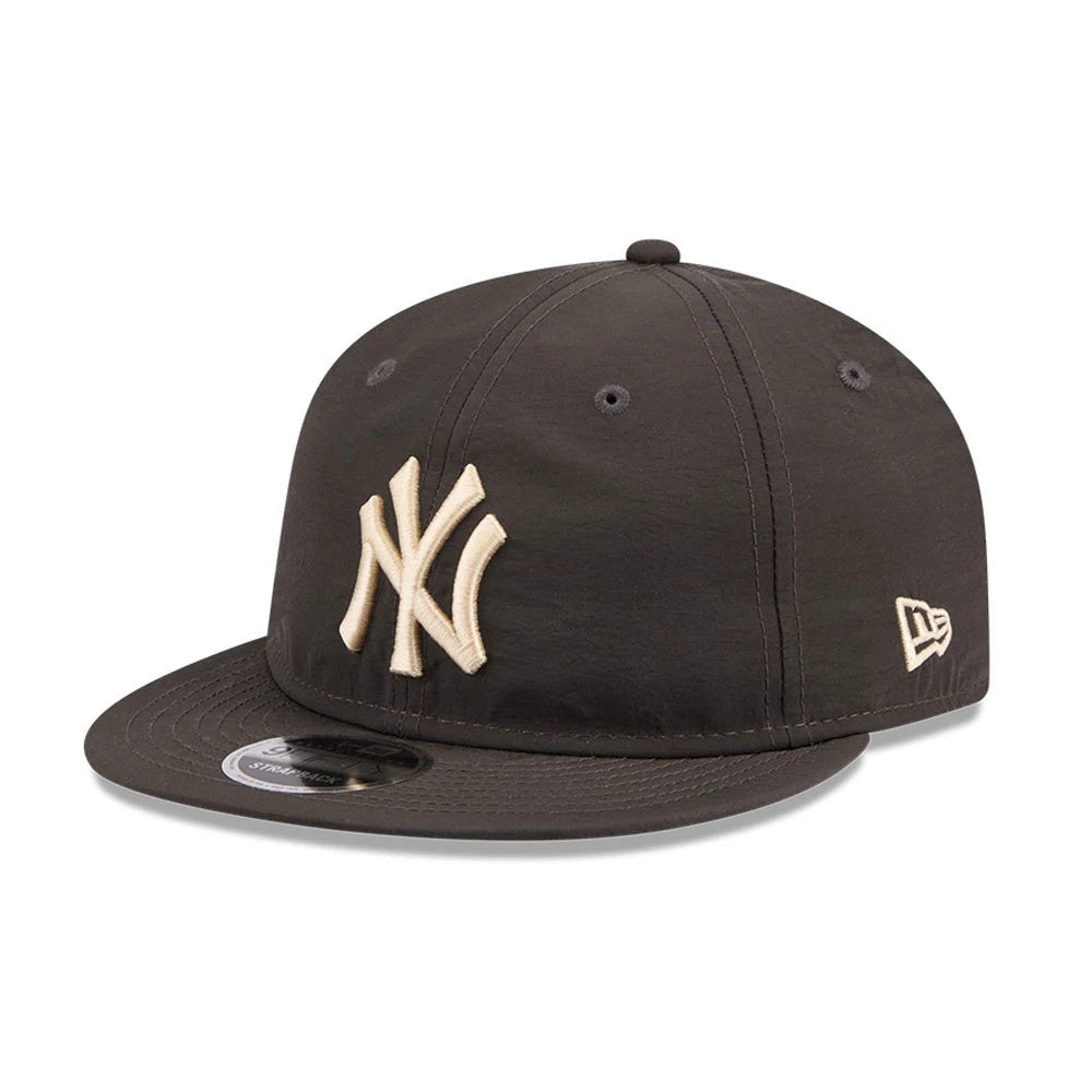 New York Yankees MLB Nylon Black Retro Crown New Era 9FIFTY Adjustable Cap, three-quarter view showing raised cream NY logo embroidery on the front panel, matching cream New Era flag logo on the left side.
