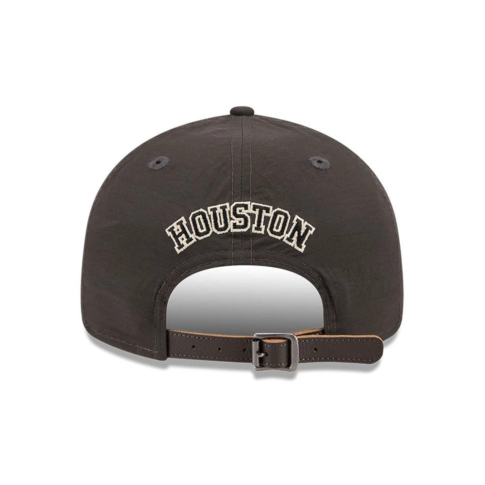 Houston Astros MLB Nylon Black Retro Crown New Era 9FIFTY Adjustable Cap, rear view showing the cream embroidered 'Houston' lettering curved across the back panels, a brown adjustable strap with a buckle, and the black nylon fabric.
