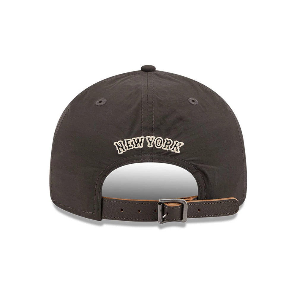 New York Mets MLB Nylon Black Retro Crown New Era 9FIFTY Adjustable Cap, rear view showing New York script in white embroidery on the structured black crown, with a brown adjustable leather strap and a black top button.
