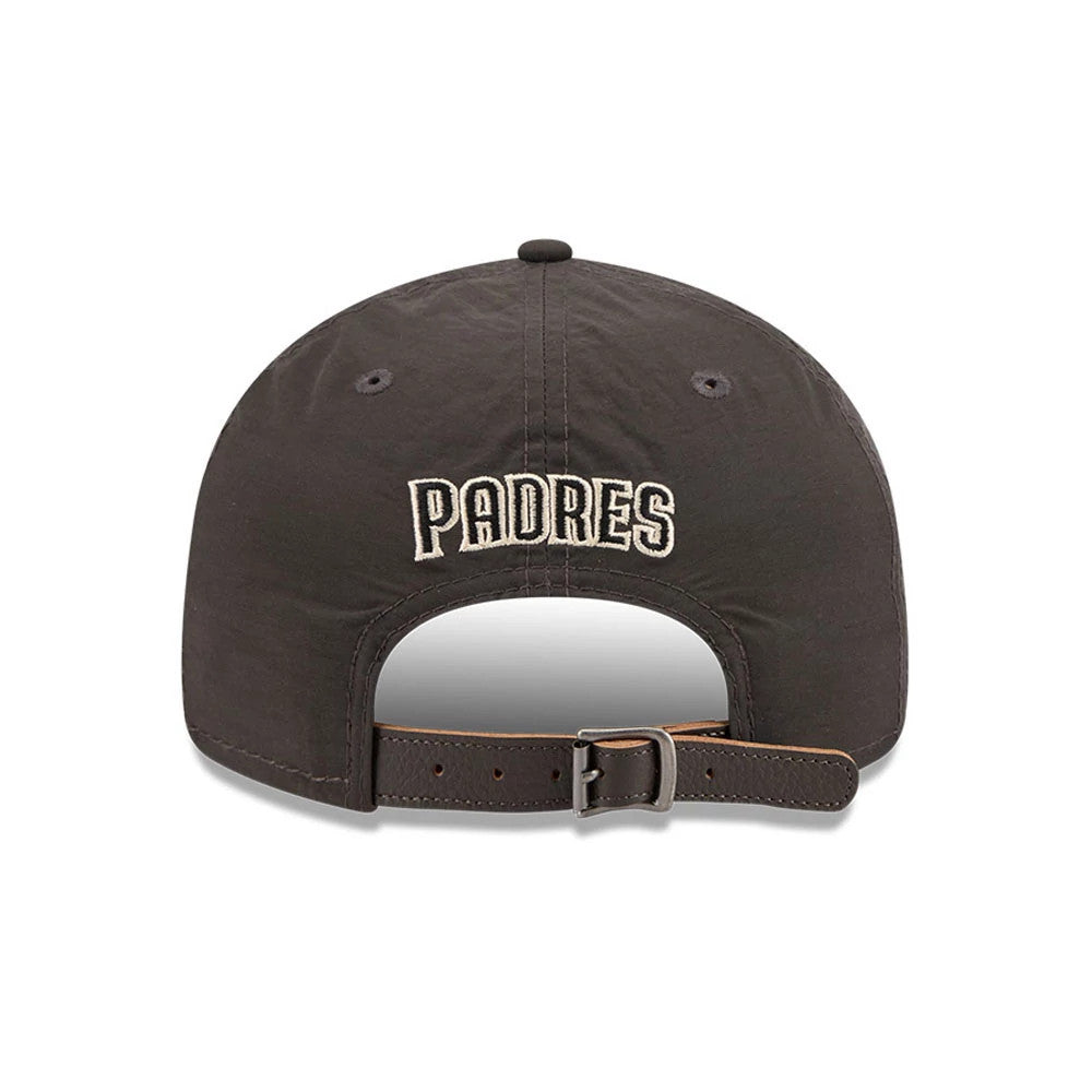 San Diego Padres MLB Nylon Black Retro Crown New Era 9FIFTY Adjustable Cap, rear view showing the white embroidered PADRES lettering across the back panel, with a black strap and buckle for adjusting the fit.