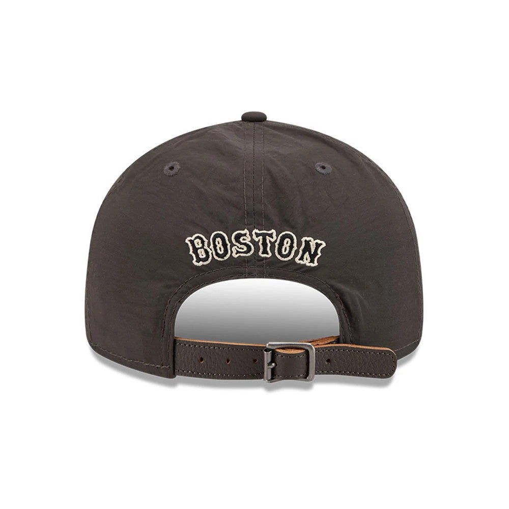 Boston Red Sox MLB Nylon Black Retro Crown New Era 9FIFTY Adjustable Cap, rear view showing the embroidered Boston lettering in cream on the back panels, with a curved opening and a dark leather strap with a buckle.