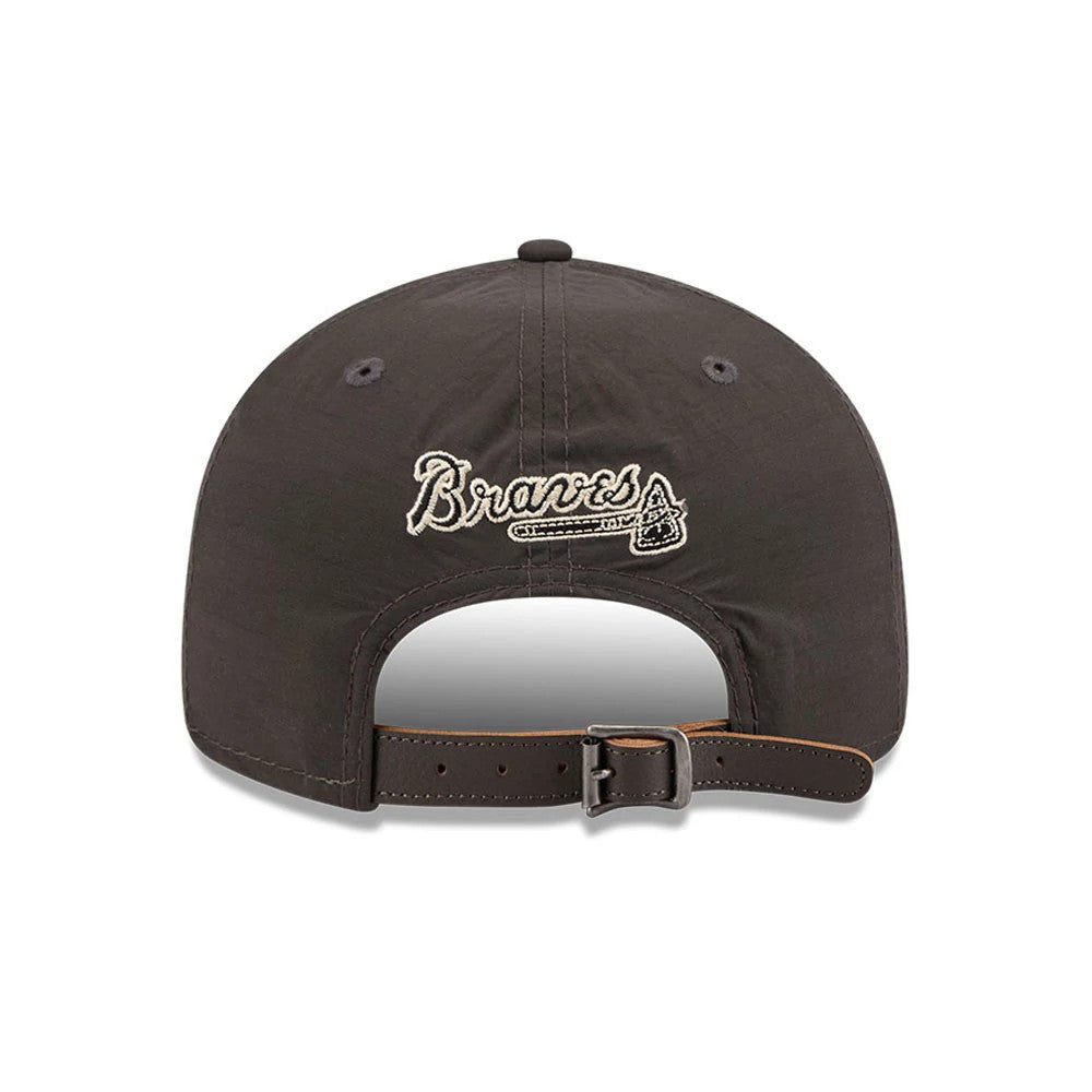 Atlanta Braves MLB Nylon Black Retro Crown New Era 9FIFTY Adjustable Cap, rear view showing the cream embroidered Braves logo and bat design on the back panels, with a brown adjustable strap and black top button on the crown.