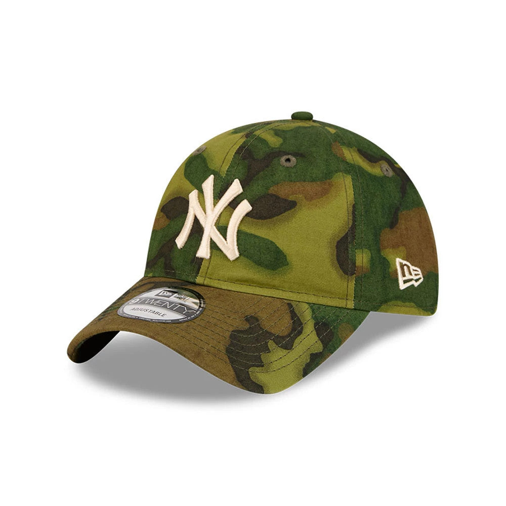 New York Yankees MLB Ripstop Camo New Era 9TWENTY Adjustable Cap, three-quarter view showing the white raised embroidered NY logo on the front panel, camo-patterned curved visor with a 9TWENTY size sticker, and New Era flag logo on the left side.