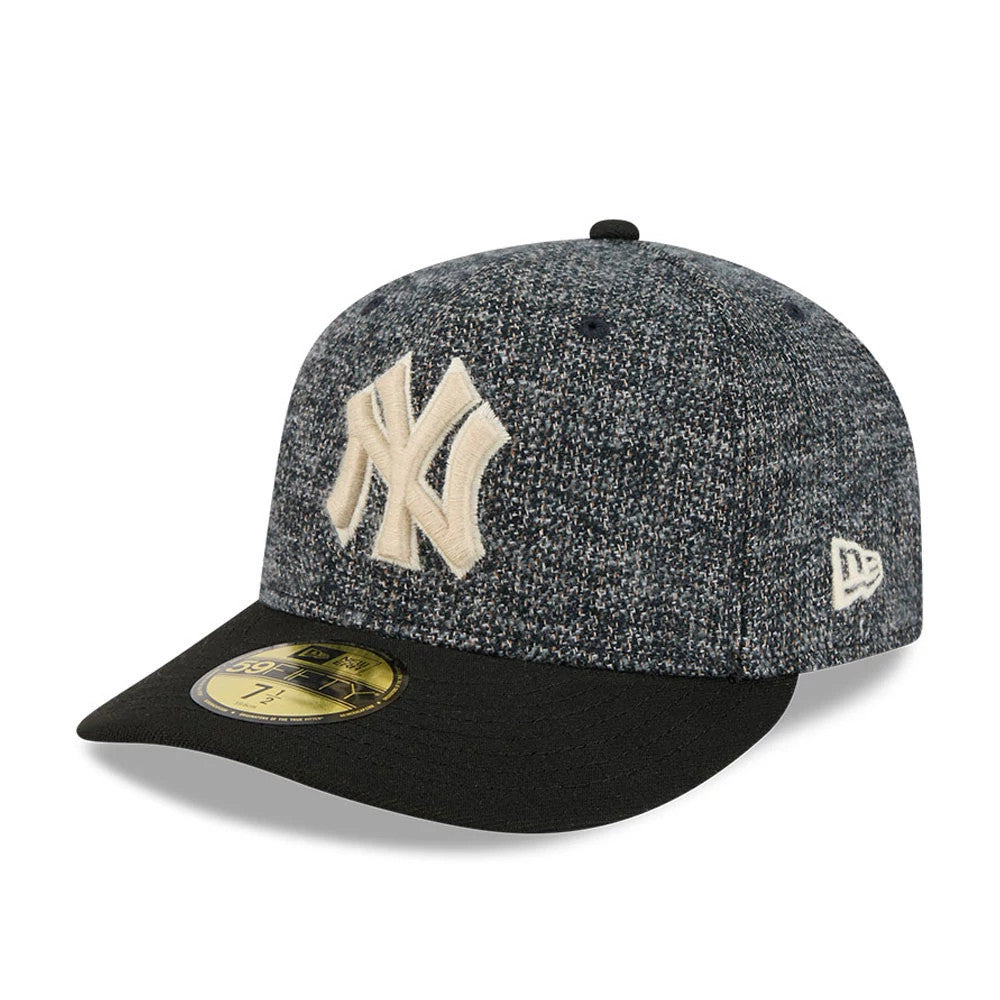 New York Yankees MLB Tweedy Cotton Black New Era 59FIFTY Fitted Cap, three-quarter view showing the large cream embroidered NY logo on the textured black and grey speckled crown, black flat visor, and a gold 59FIFTY size sticker on the visor.