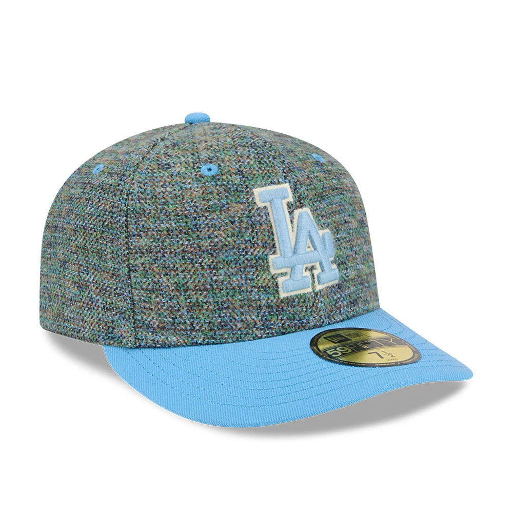 LA Dodgers MLB Tweedy Cotton Pastel Blue New Era 59FIFTY Fitted Cap, three-quarter view showing the raised white and blue embroidered LA logo on the front panel, pastel blue flat visor, and gold 59FIFTY size sticker on the visor.