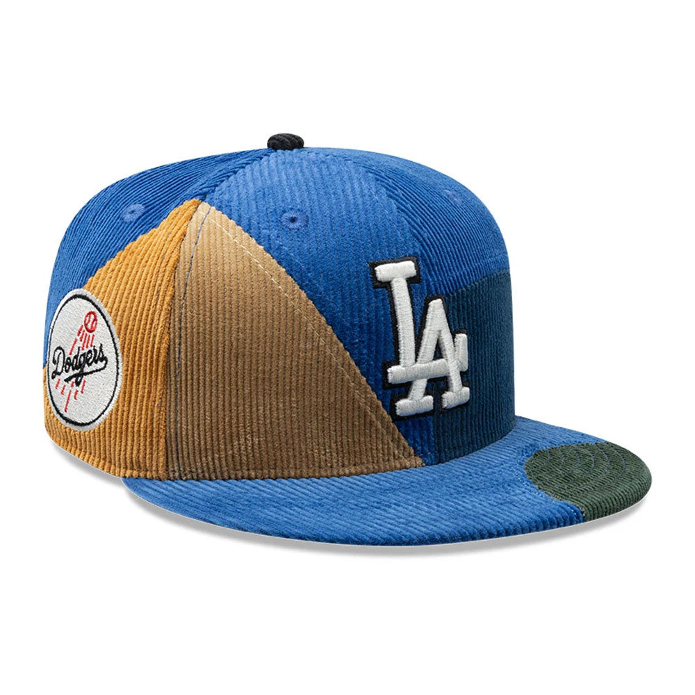 LA Dodgers MLB Patchwork Dark Blue New Era 59FIFTY Fitted Cap, three-quarter view showing a white raised LA logo embroidered on the front panel, a multi-coloured patchwork design with shades of blue, tan, and green, and a flat blue visor.
