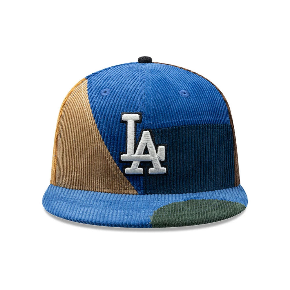 LA Dodgers MLB Patchwork Dark Blue New Era 59FIFTY Fitted Cap, front view showing the white raised LA logo on a patchwork design with blue, brown, and green corduroy panels, matched with a blue visor and black top button.