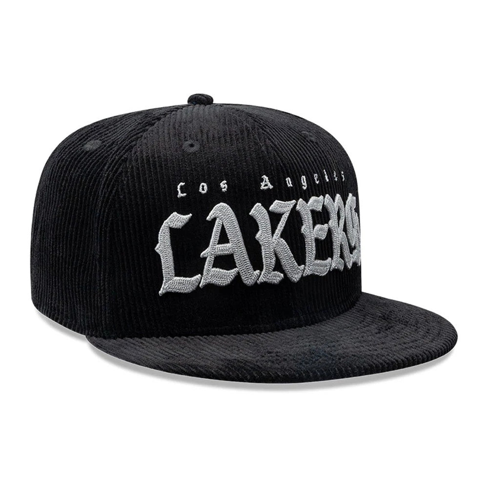 LA Lakers NBA Old English Black New Era 9FIFTY Snapback Cap, three-quarter view showing the grey embroidered Lakers in Old English font on the structured black crown, with a matching flat black visor and top button.
