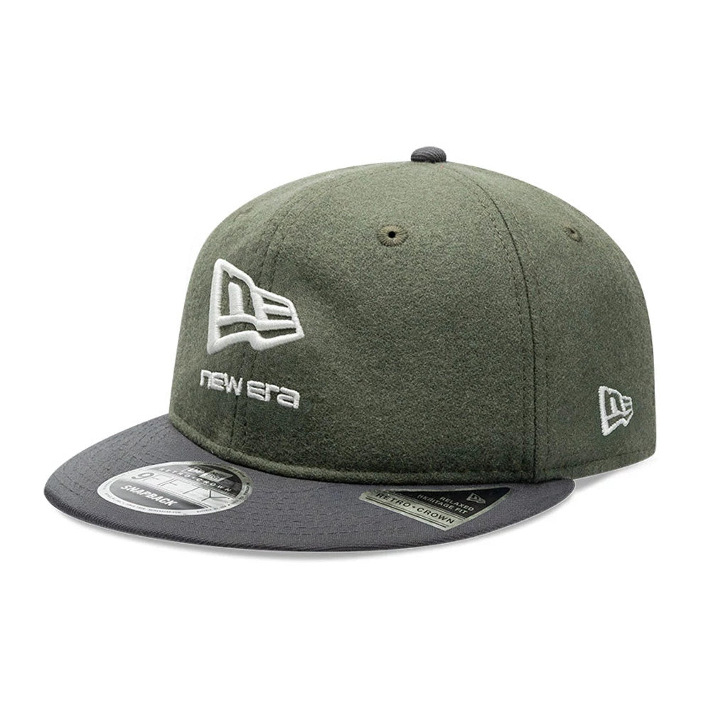 New Era Melton Wool Green Retro Crown 9FIFTY Cap, three-quarter view showing the white embroidered New Era flag logo on the front panel, dark grey visor with a 9FIFTY size sticker, and an additional New Era flag logo on the left side.