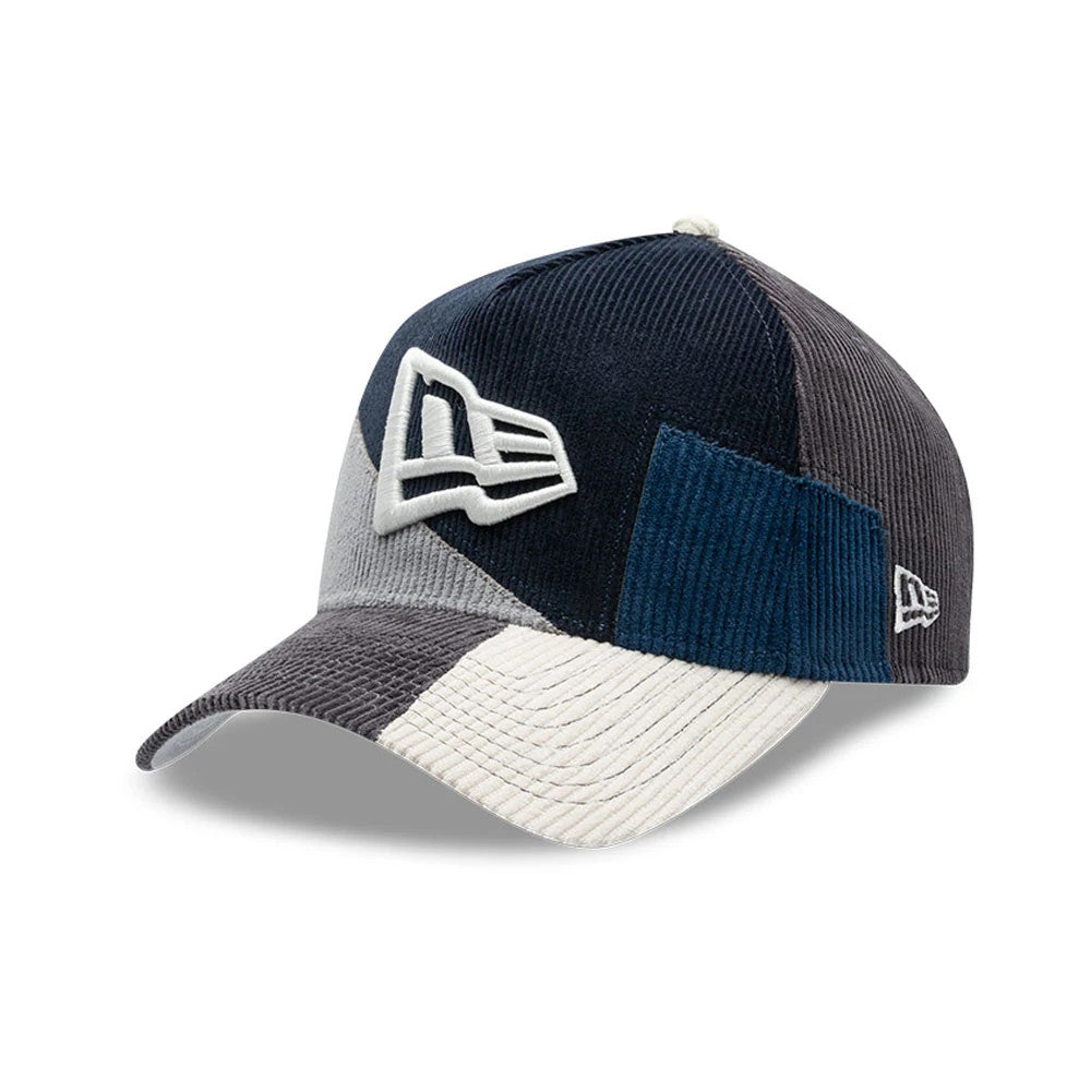 New Era Patchwork Black 9FORTY A-Frame Cap, three-quarter view showcasing a textured patchwork design with a prominent raised white embroidered New Era flag logo on the front panel, complemented by a curved visor.