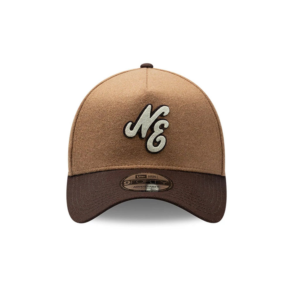 New Era Melton Wool Beige 9FORTY A-Frame Cap, front view showing a raised embroidered NE logo in cream on the beige melton wool front panels, with a contrasting dark brown curved visor and a 9FORTY size sticker on the underside.