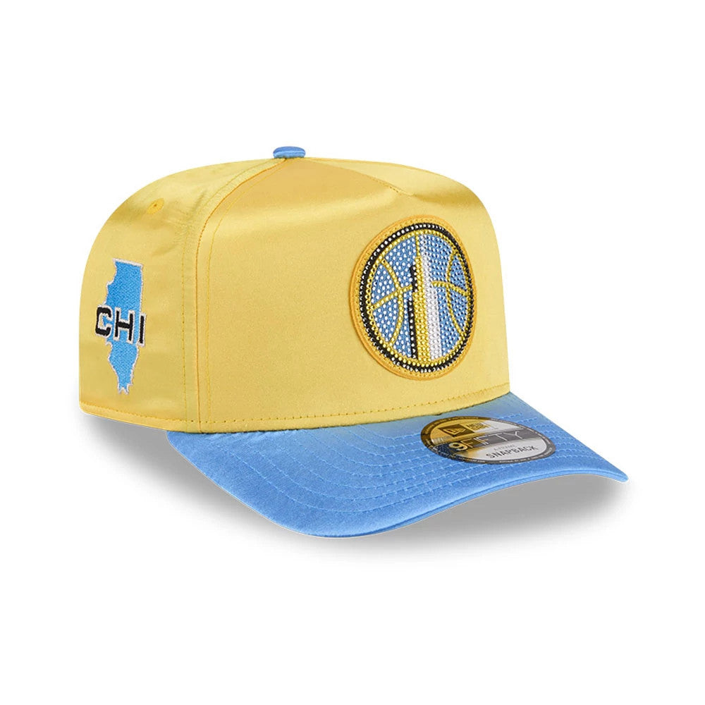 Sky WNBA Draft 2026 Yellow New Era 9FIFTY A-Frame Snapback Adjustable Cap, three-quarter view showing a rhinestone-embellished basketball logo on the front panel, a blue undervisor, and an embroidered CHI logo with state outline on the left side.